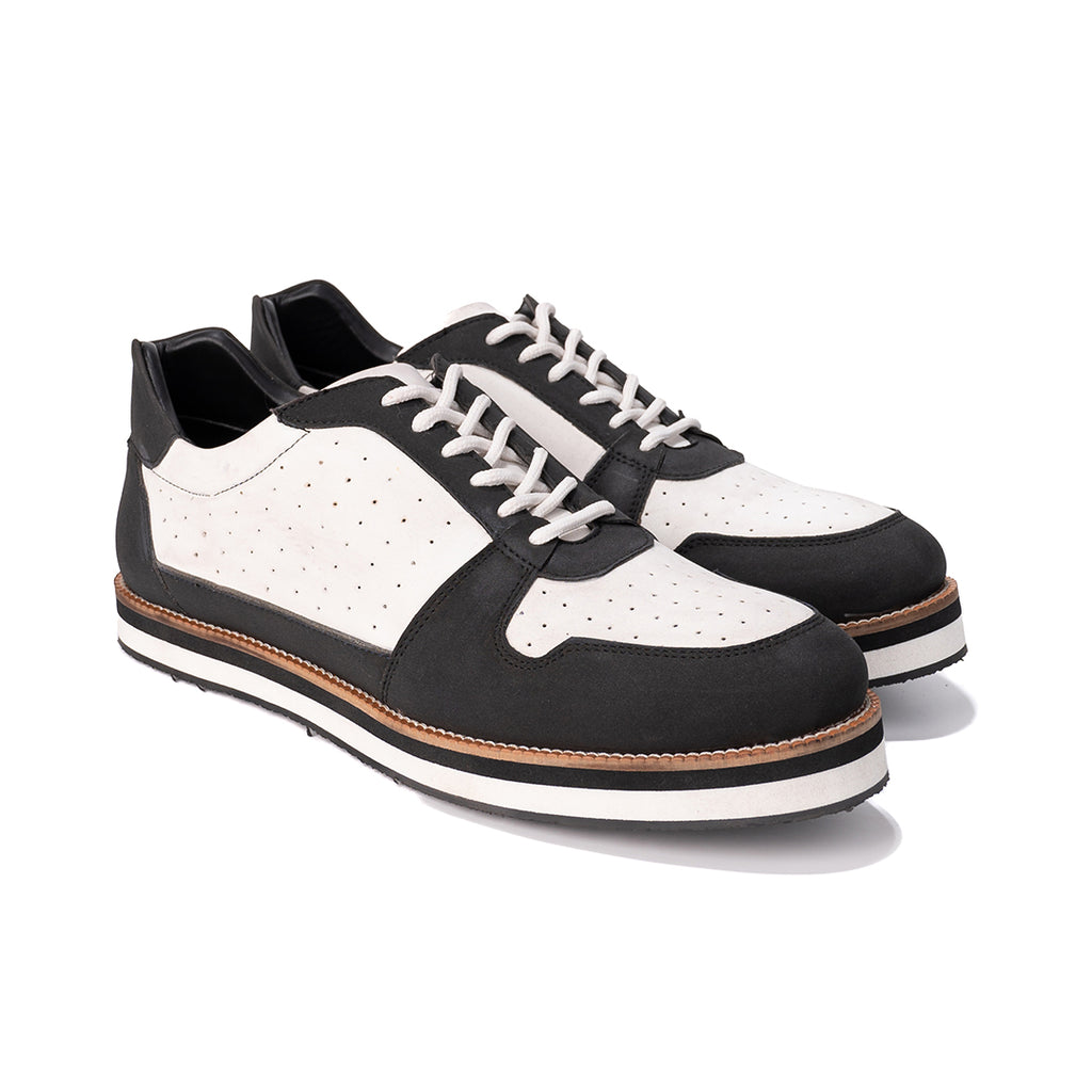 White and black sneaker with perforations