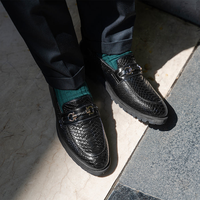 Black slip-ons with textured detail