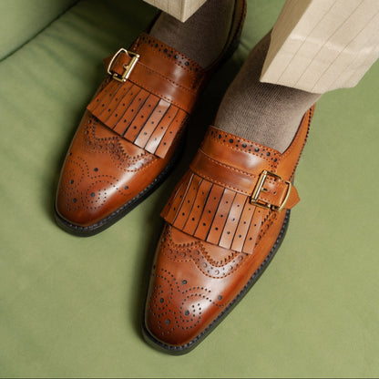 TAN SLIP-ONS WITH FRINGE