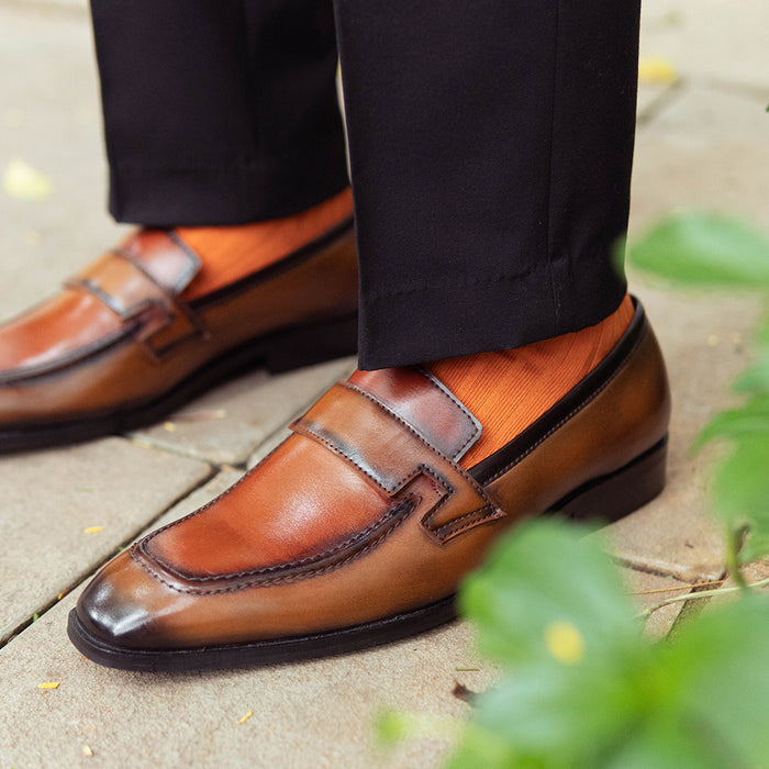 TAN SLIP-ONS WITH APRON STITCH DETAIL